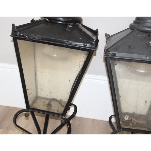 251 - A pair of Victorian style black painted copper street lamp or lantern tops, likely 20th century with... 