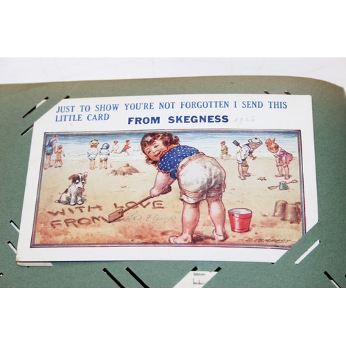 576 - An antique postcard album and contents to inc many early 20th century humorous cards