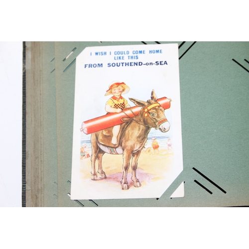 576 - An antique postcard album and contents to inc many early 20th century humorous cards