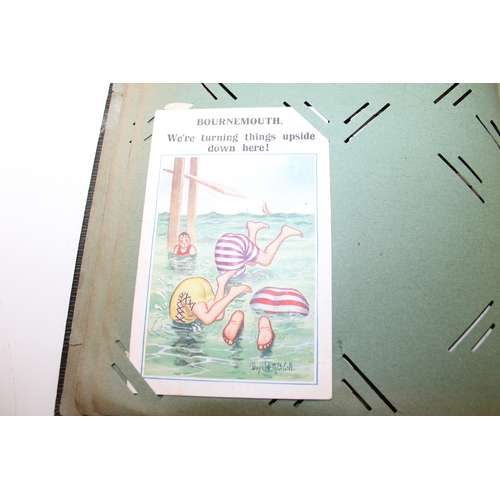 576 - An antique postcard album and contents to inc many early 20th century humorous cards