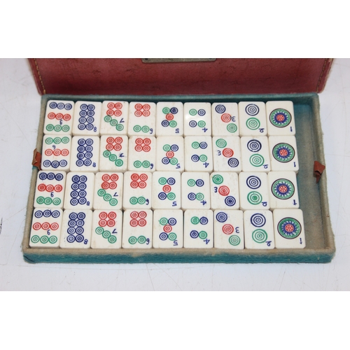 641 - A vintage bone and bamboo mah-jong set in case, 112 tiles with extras in vintage leather effect case