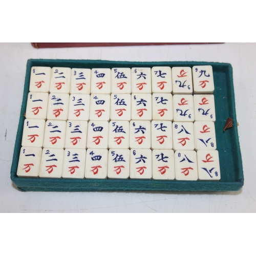 641 - A vintage bone and bamboo mah-jong set in case, 112 tiles with extras in vintage leather effect case