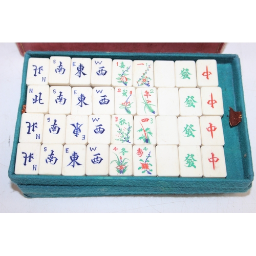 641 - A vintage bone and bamboo mah-jong set in case, 112 tiles with extras in vintage leather effect case