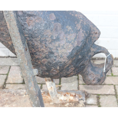 1428 - An antique cast iron cannon on later iron base, seemingly without marks but believed to be 18th/19th... 