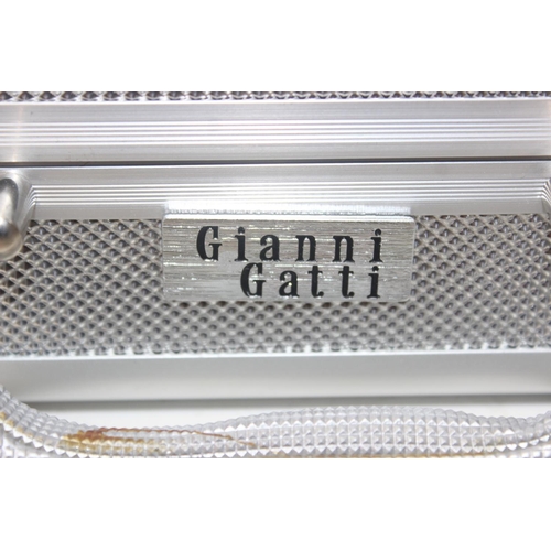 1535 - A boxed set of chef knives by Gianni Gatti, 11 piece set in aluminium case