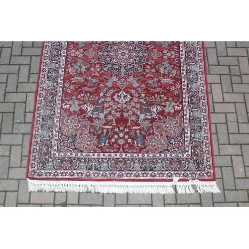 213 - A vintage red ground Turkish Hali made Shiraz designed rug with hand finished details, fine quality,... 