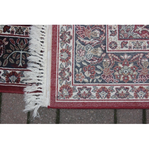 213 - A vintage red ground Turkish Hali made Shiraz designed rug with hand finished details, fine quality,... 