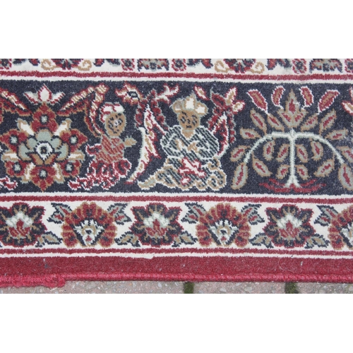 213 - A vintage red ground Turkish Hali made Shiraz designed rug with hand finished details, fine quality,... 