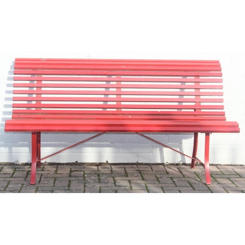 304 - Red painted metal bench with matching side table, approx 150cm W x 68cm D x 80cm H