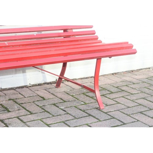 304 - Red painted metal bench with matching side table, approx 150cm W x 68cm D x 80cm H