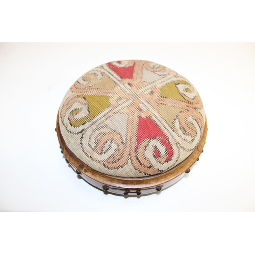 14 - A Victorian tapestry topped footstool of Gothic revival style, approx 28cm in diameter