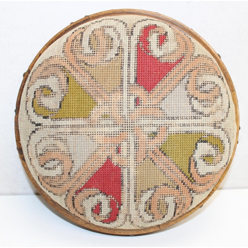 14 - A Victorian tapestry topped footstool of Gothic revival style, approx 28cm in diameter