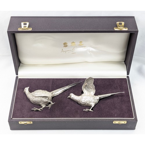 1024 - A pair of superb quality cast silver pheasants by Asprey & Garrard, each marked for London 2000 by A... 