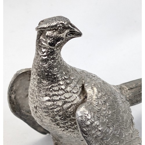 1024 - A pair of superb quality cast silver pheasants by Asprey & Garrard, each marked for London 2000 by A... 