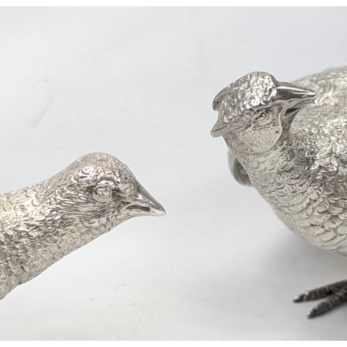 1024 - A pair of superb quality cast silver pheasants by Asprey & Garrard, each marked for London 2000 by A... 