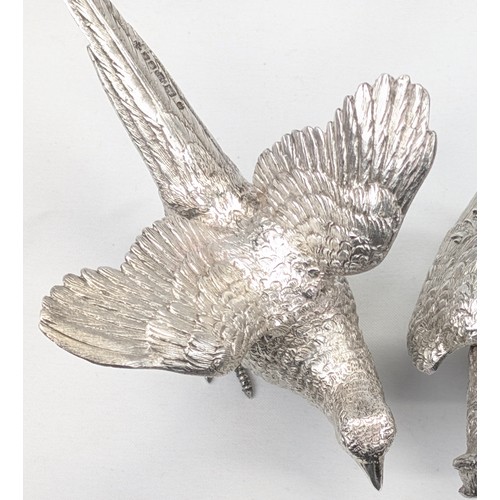 1024 - A pair of superb quality cast silver pheasants by Asprey & Garrard, each marked for London 2000 by A... 