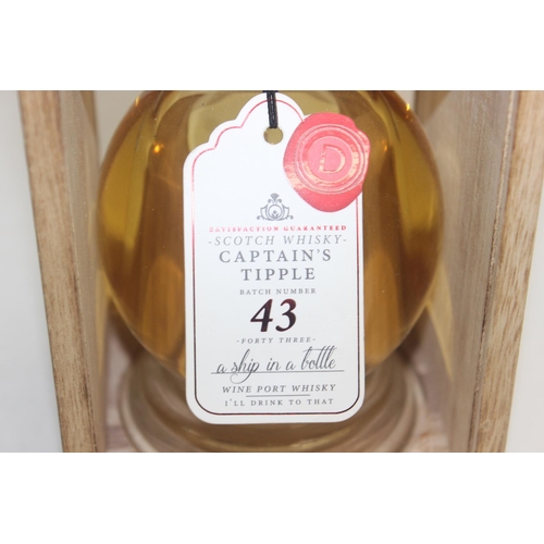 1544 - A bottle of Captain's Tipple Scotch Whisky batch 43, with lampwork glass ship in the bottle, present... 