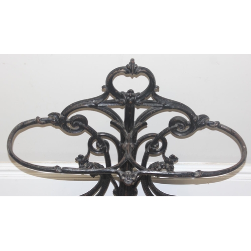 141 - A 19th century cast iron stick stand with drip tray, both pieces with various marks to inc the Victo... 