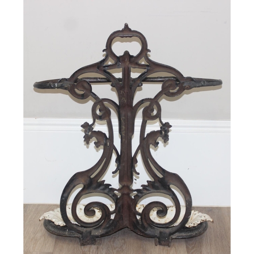 141 - A 19th century cast iron stick stand with drip tray, both pieces with various marks to inc the Victo... 