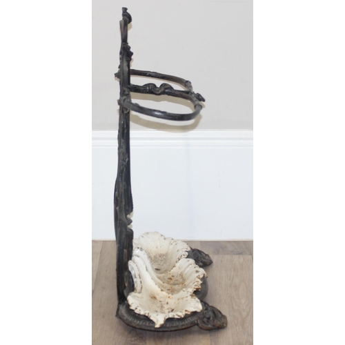 141 - A 19th century cast iron stick stand with drip tray, both pieces with various marks to inc the Victo... 