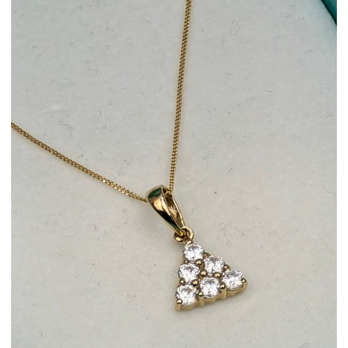 1171 - A vintage 14ct gold pendant on fine 14ct gold chain, the pendant set with white stones in a triangul... 