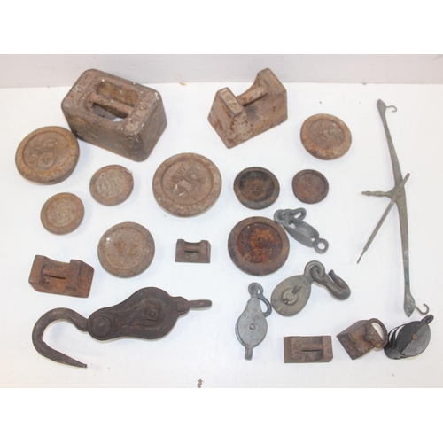 1693 - Qty of assorted vintage iron weights and vintage pulleys etc