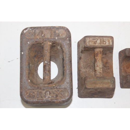 1693 - Qty of assorted vintage iron weights and vintage pulleys etc