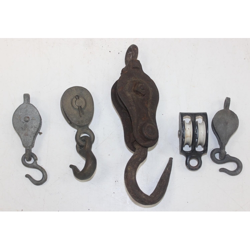 1693 - Qty of assorted vintage iron weights and vintage pulleys etc