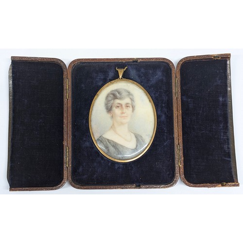 1492A - An antique English School portrait miniature of a female with pearl necklace, signed lower right HMK... 