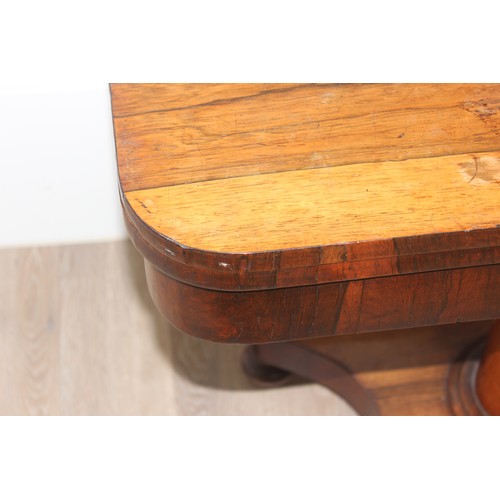 40 - A Victorian Rosewood card table with foldover top and green baize lined interior, approx 92cm wide x... 