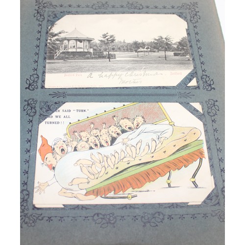 564 - An antique postcard album and contents, mainly scenes of London and UK places, some humorous and ani... 