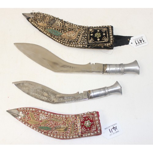 1411 - 2 alloy-hilted Kukri knives, 1 with jewelled-red velvet scabbard, the other longer and with jewelled... 