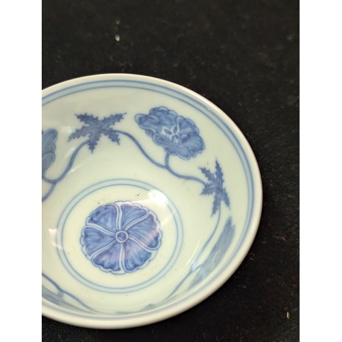 1455 - A Chinese blue & white porcelain tea bowl decorated with floral motifs, Chenghua (1464-1487) 6 chara... 