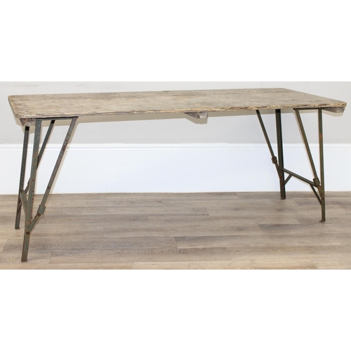 181 - A vintage weathered pine trestle table with folding metal legs, mid-late 20th century, approx 178cm ... 