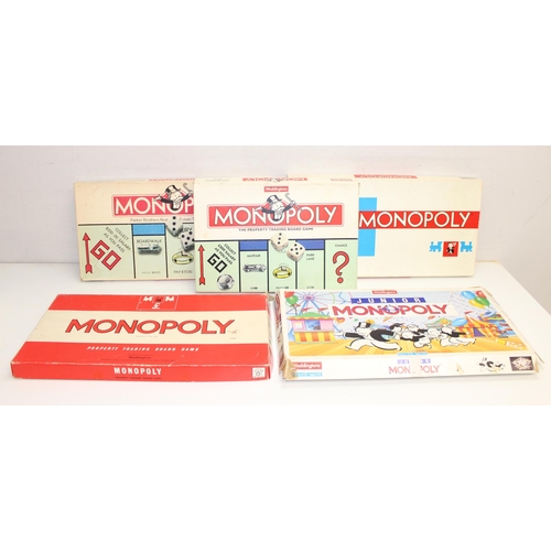 619 - 13 assorted vintage Monopoly editions to include a Monopoly kids edition etc