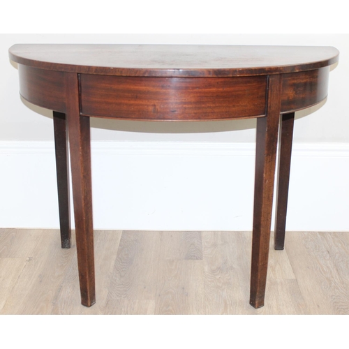 130 - A Georgian mahogany demi-lune side table with square tapered legs, approx 107cm wide x 54cm deep x 7... 