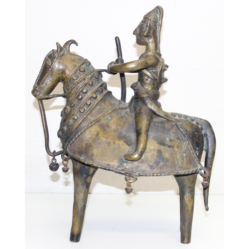 1406 - A large cast metal figure of a horse and rider, possibly South Indian, made from a bronze-like coppe... 