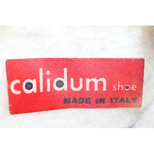 201 - A pair of vintage Inuit style leather and fur boots by Calidum of Italy, no size and a vintage fur m... 