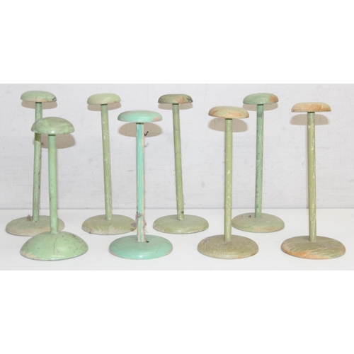 272 - 8 assorted vintage distressed painted wooden hat or wig stands, green painted finish, the largest ap... 