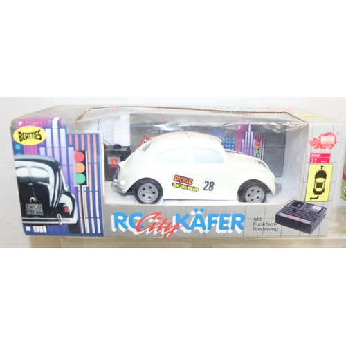 604 - Qty of assorted Volkswagen and VW Camper related collectables to inc many boxed diecast vehicles, to... 