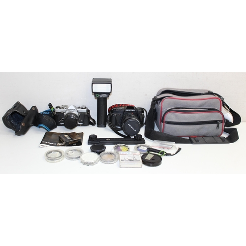 702 - Qty of assorted cameras and other optical related items to inc Olympus OM-1 with lens, various acces... 