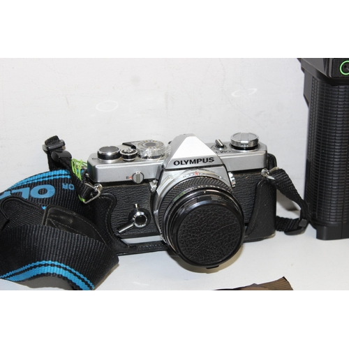 702 - Qty of assorted cameras and other optical related items to inc Olympus OM-1 with lens, various acces... 