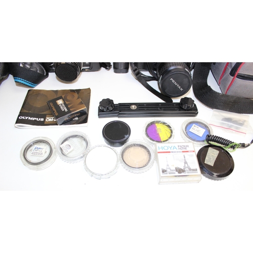 702 - Qty of assorted cameras and other optical related items to inc Olympus OM-1 with lens, various acces... 