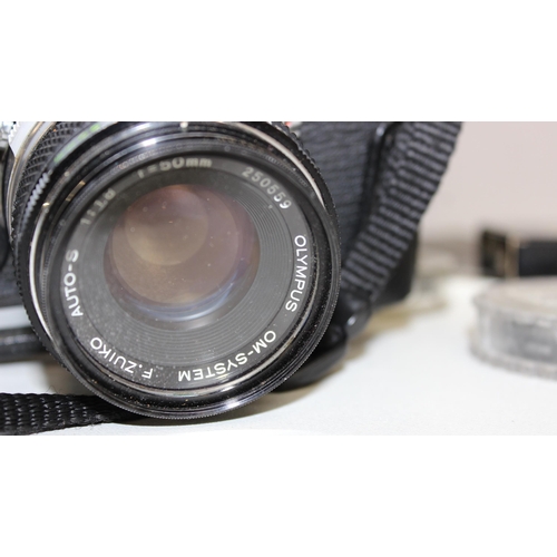 702 - Qty of assorted cameras and other optical related items to inc Olympus OM-1 with lens, various acces... 