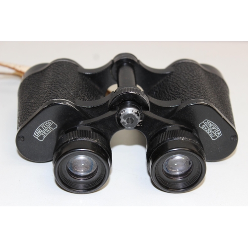 703 - A pair of Carl Zeiss Jena Jenoptem 8x30w binoculars in original leather case