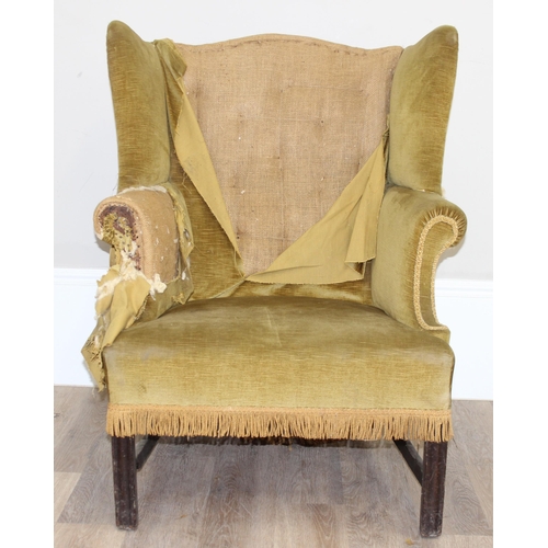 136 - An antique wing back armchair with green gold partial upholstery, likely George III period c.1800, e... 