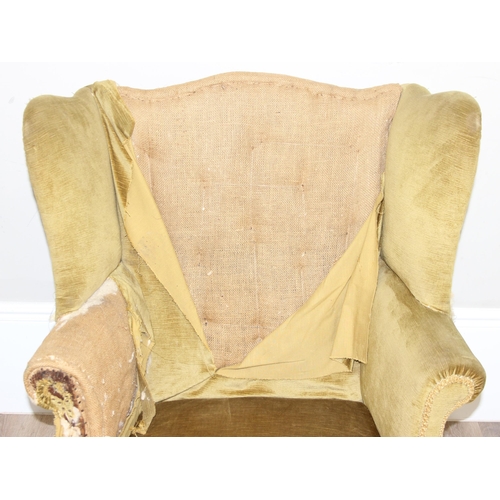 136 - An antique wing back armchair with green gold partial upholstery, likely George III period c.1800, e... 