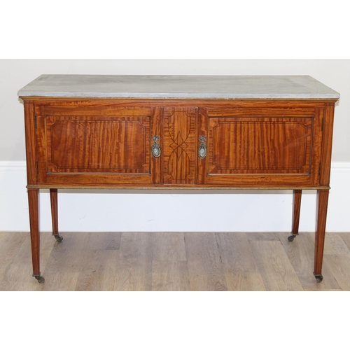 177 - An antique mahogany wash stand with grey marbles top, the 2 doors with inlaid details, brass ring ha... 