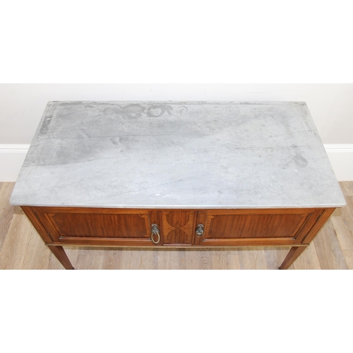 177 - An antique mahogany wash stand with grey marbles top, the 2 doors with inlaid details, brass ring ha... 