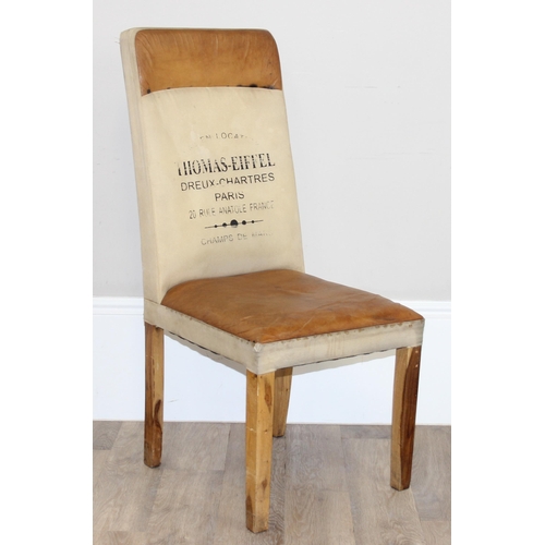 91 - A set of 4 modern leather and canvas dining chairs with wooden legs, the backs with Paris related st... 